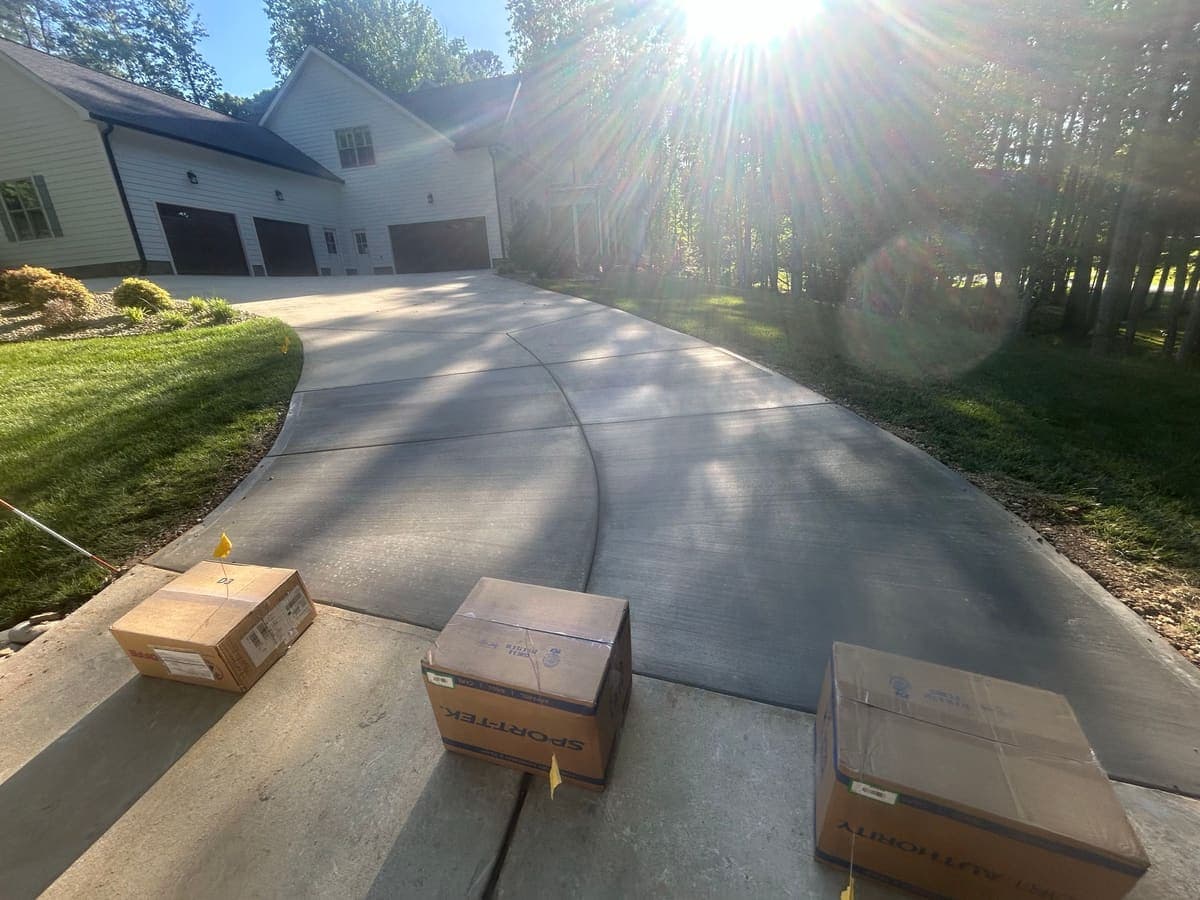 Professional Concrete Driveway Repair installation in Charlotte, North Carolina by Local Concrete Contractor — commercial-grade base prep, 6-inch compacted aggregate, expansion joints sawn within 12 hours.