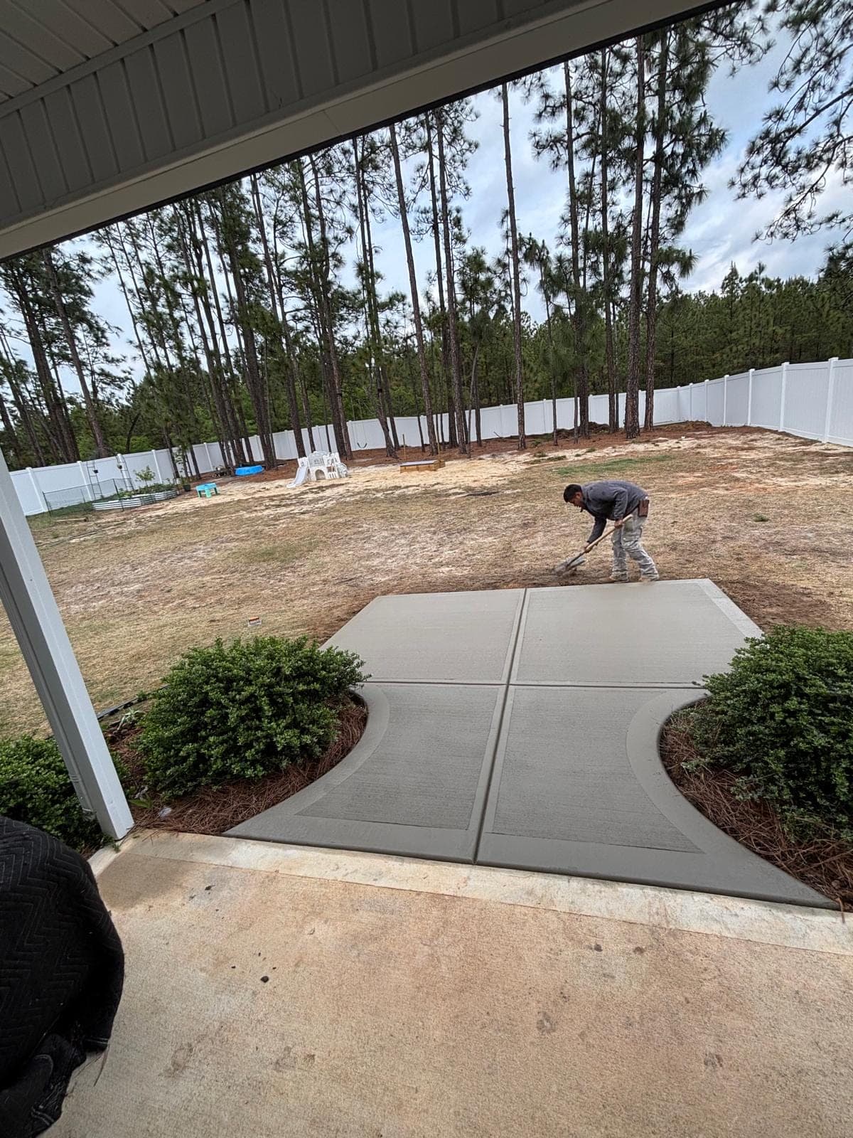 Newly poured Concrete Patio Additions in Charlotte, NC (Mecklenburg County) by Local Concrete Contractor — 4000 PSI mix, double-mat #4 rebar, broom-finish surface, 28-day full cure.