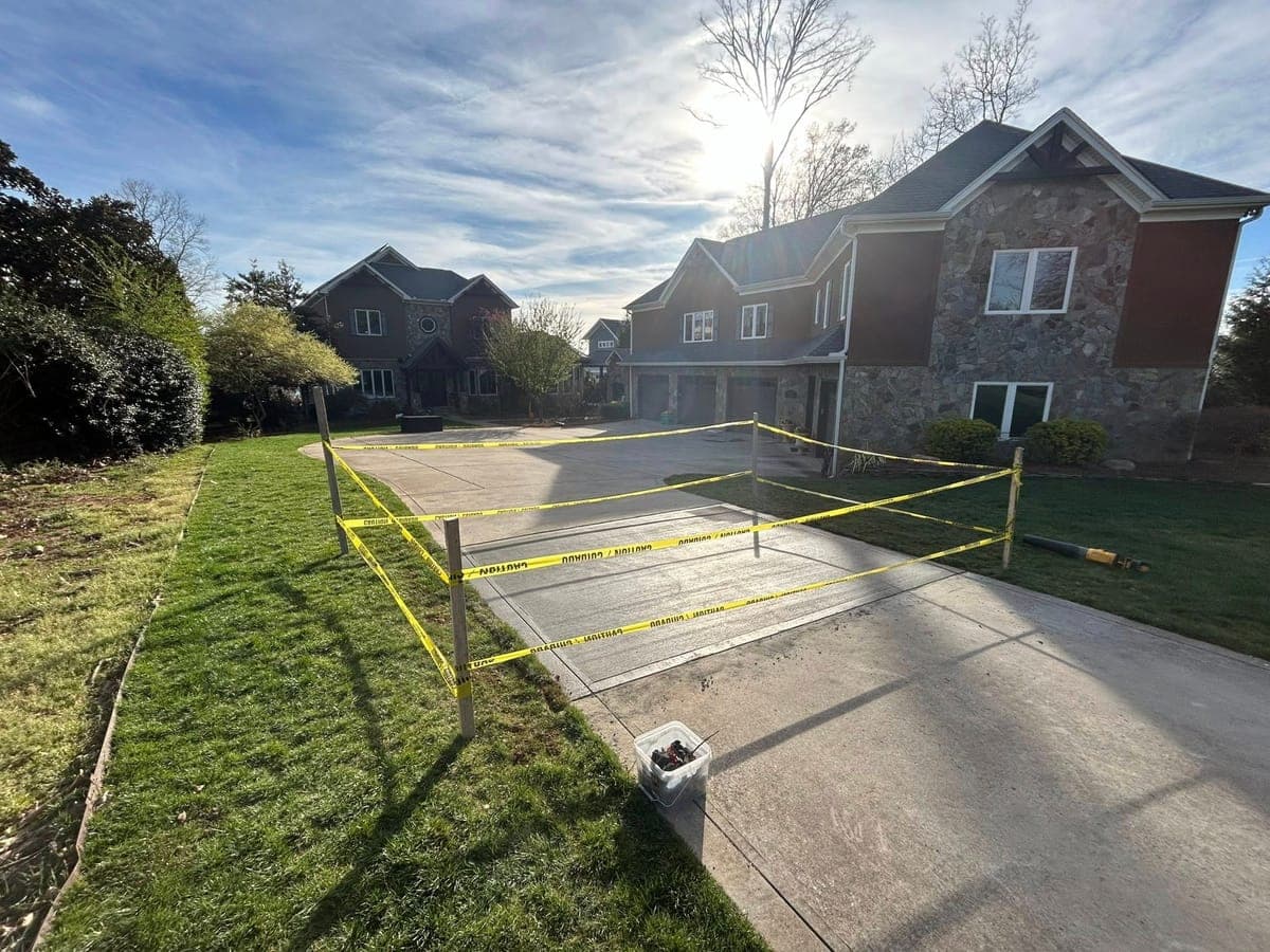 Newly poured General Driveway Repair in Charlotte, NC (Mecklenburg County) by Local Concrete Contractor — 4000 PSI mix, double-mat #4 rebar, broom-finish surface, 28-day full cure.