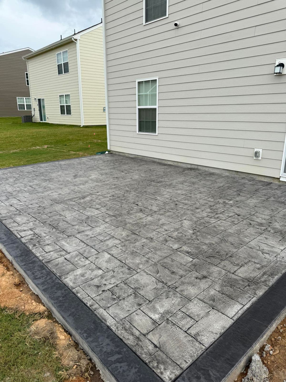 Professional Stamped Concrete installation in Charlotte, North Carolina by Local Concrete Contractor — commercial-grade base prep, 6-inch compacted aggregate, expansion joints sawn within 12 hours.
