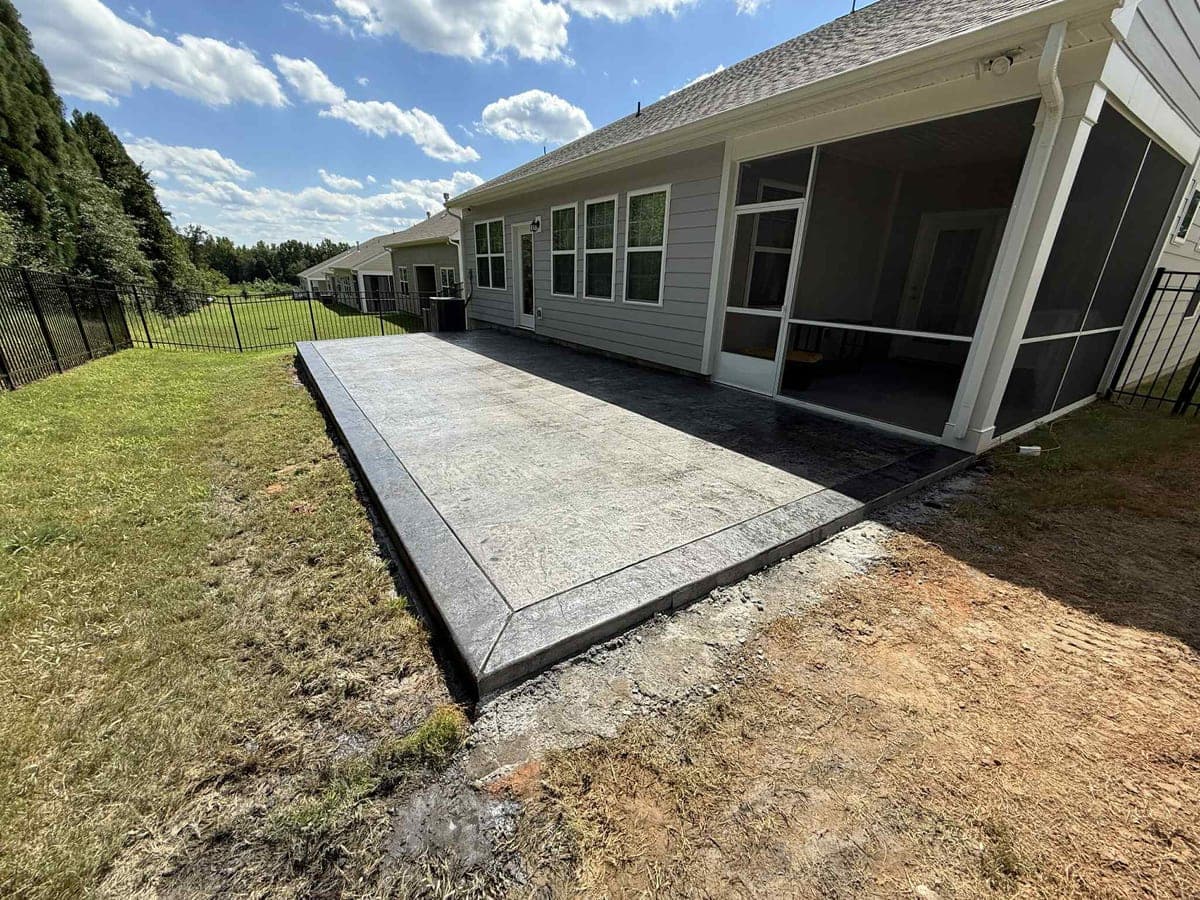Local Concrete Contractor Stamped Concrete Patios project in Charlotte, North Carolina (Mecklenburg County) — 4000 PSI commercial-grade concrete, expansion joints, professional broom or smooth finish.