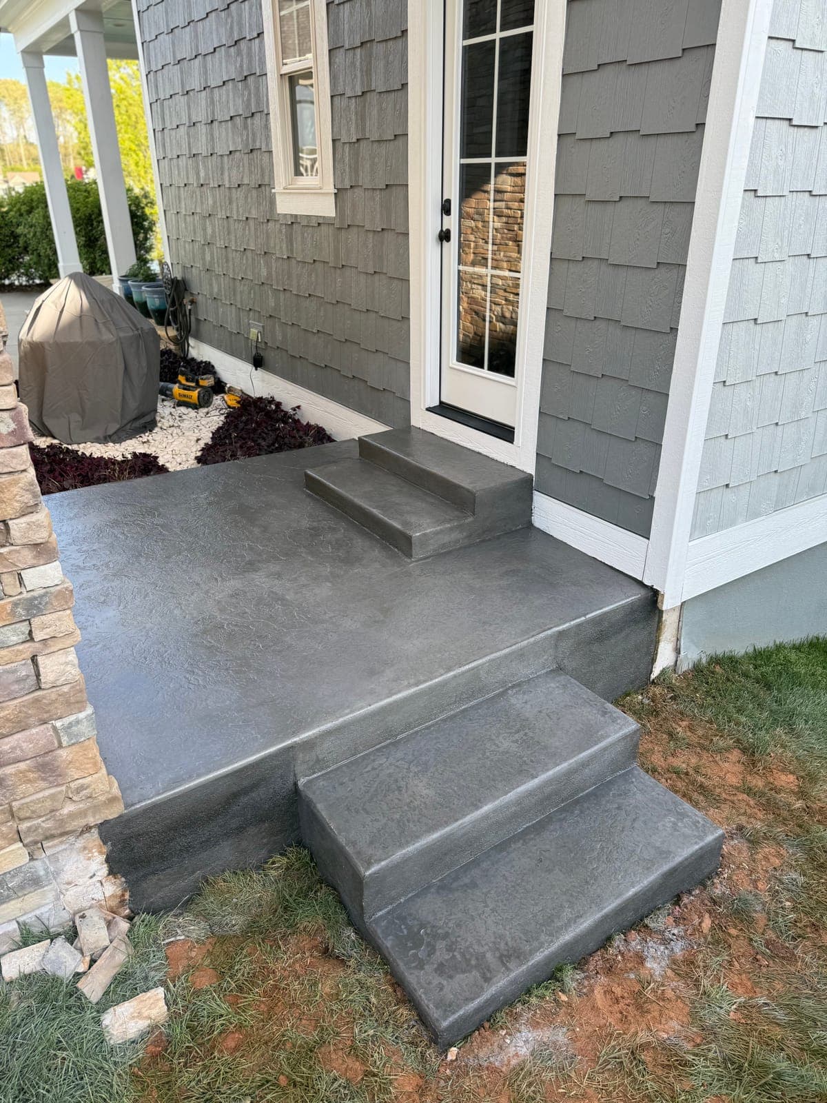 Stamped concrete sidewalk in Charlotte, NC — decorative pattern, non-slip texture, sealed finish by Local Concrete Contractor.