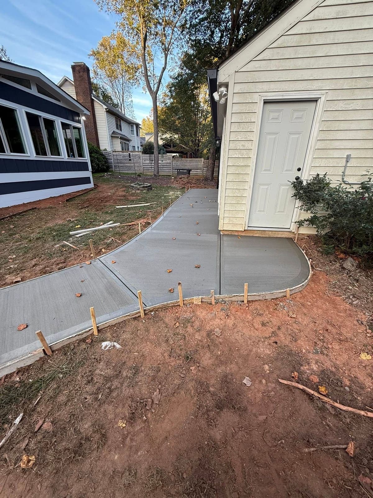 Concrete walkway in Clayton, NC — poured pathway, control joints, broom-finish surface by Local Concrete Contractor.