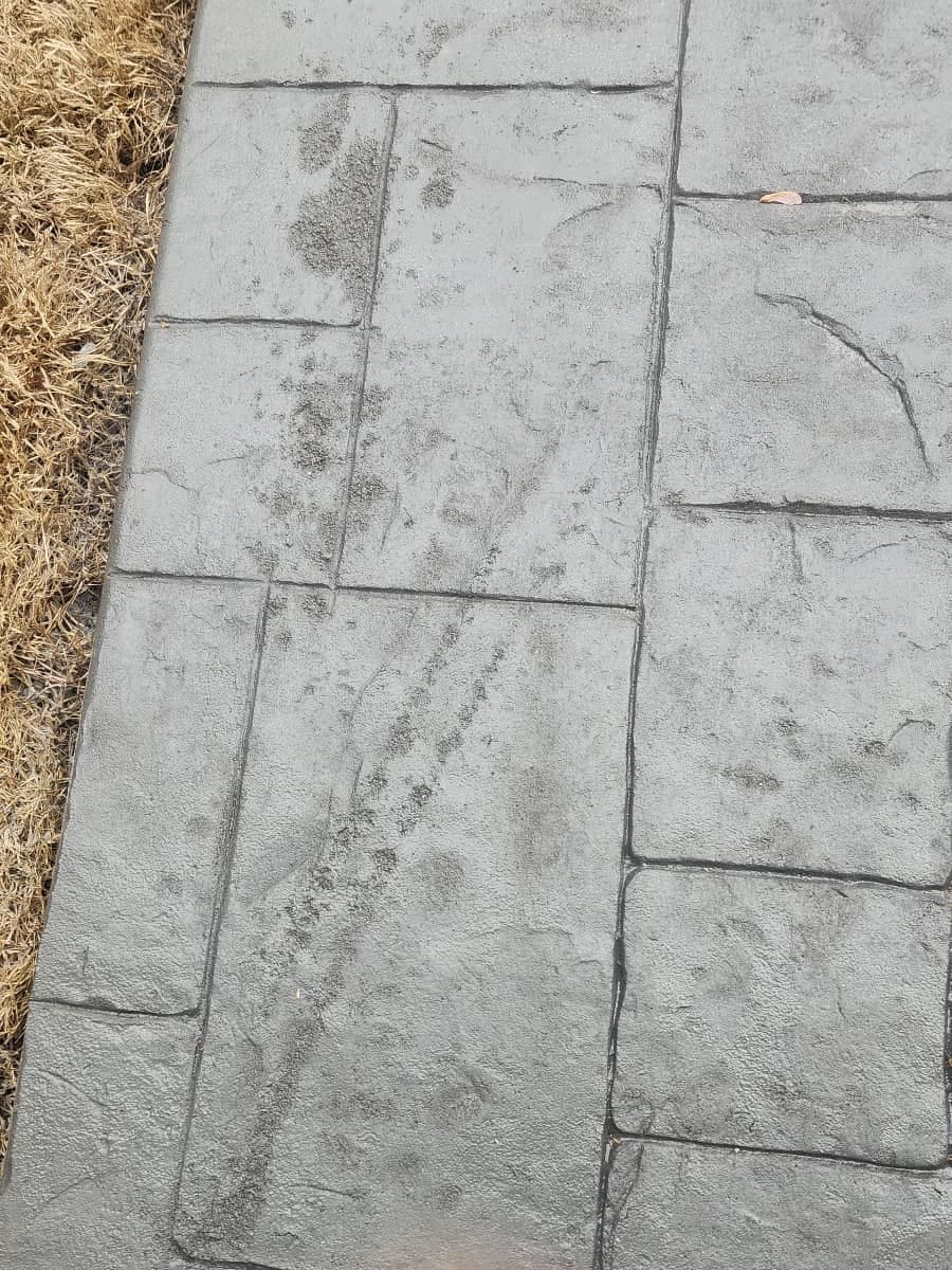Stamped concrete repair in Clayton, NC — pattern-match patch, color re-tint, resealing by Local Concrete Contractor.