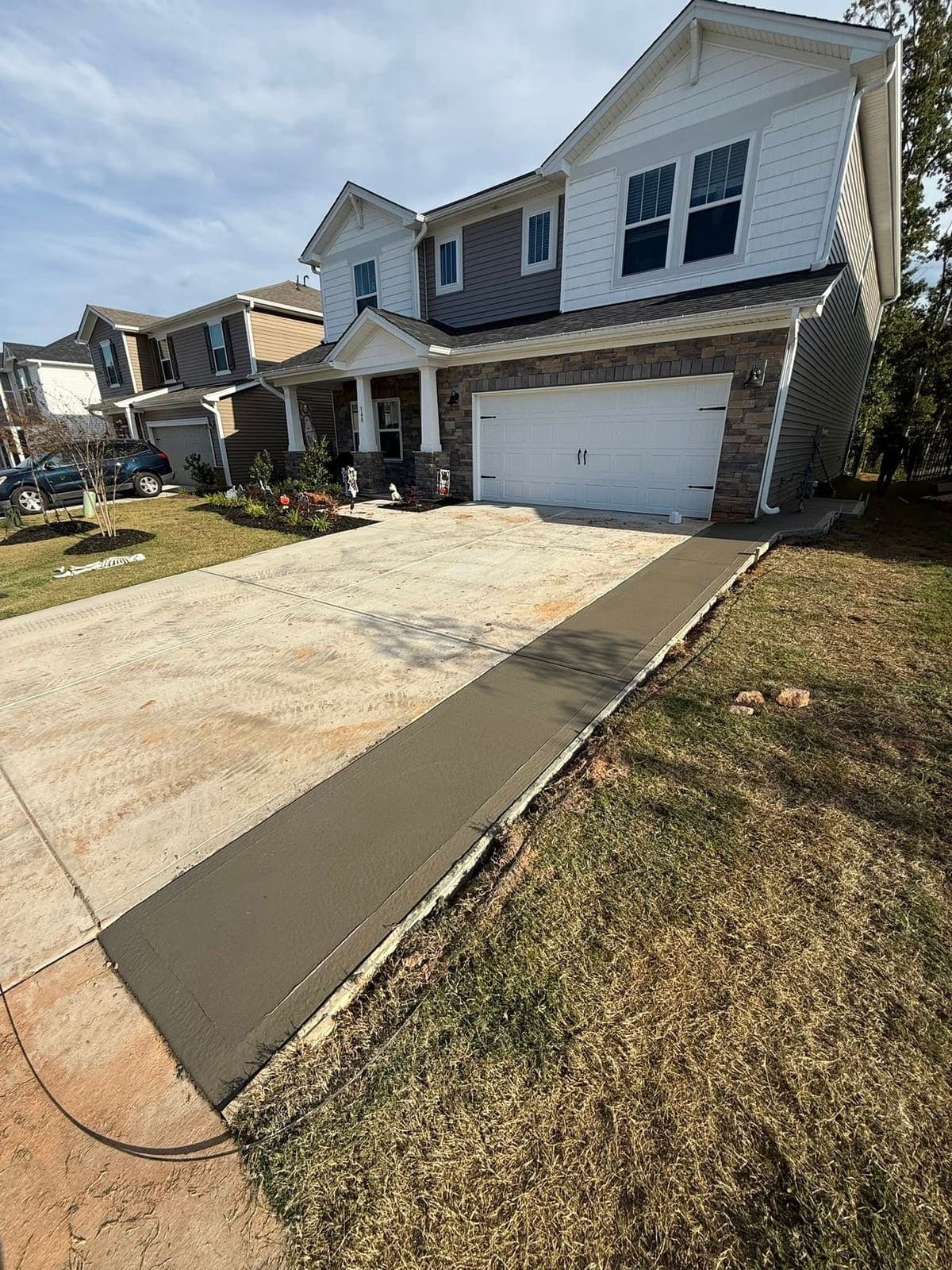 Local Concrete Contractor Concrete Driveway Extensions project in Statesville, North Carolina (Iredell County) — 4000 PSI commercial-grade concrete, expansion joints, professional broom or smooth finish.