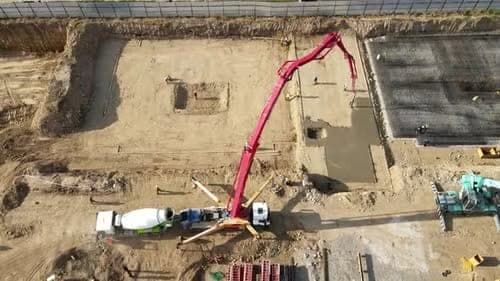 Newly poured Commercial Flatwork in Wilmington, NC (New Hanover County) by Local Concrete Contractor — 4000 PSI mix, double-mat #4 rebar, broom-finish surface, 28-day full cure.
